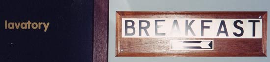 Breakfast with arrow pointing to Lavatory sign